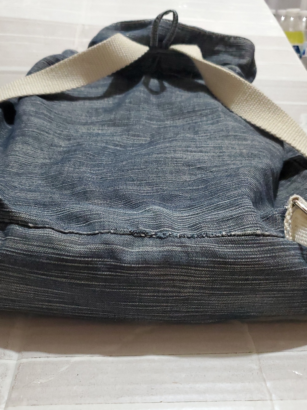 Denim-Look Drawstring Backpack with Cream Strap Details - Picture 10 of 12